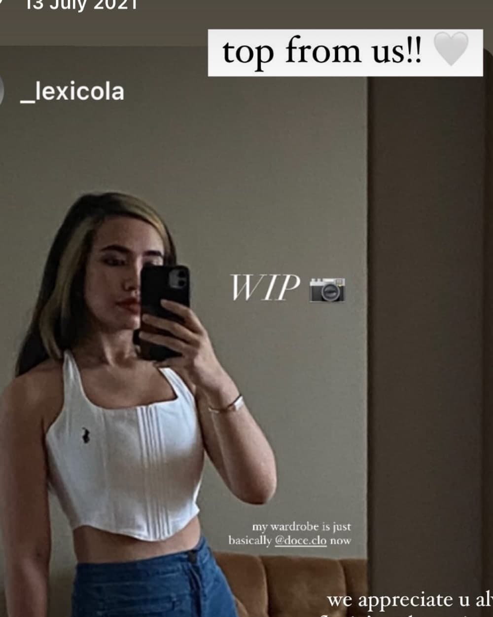 A customer in a white doce corset top with wide-leg denim, taken in a mirror