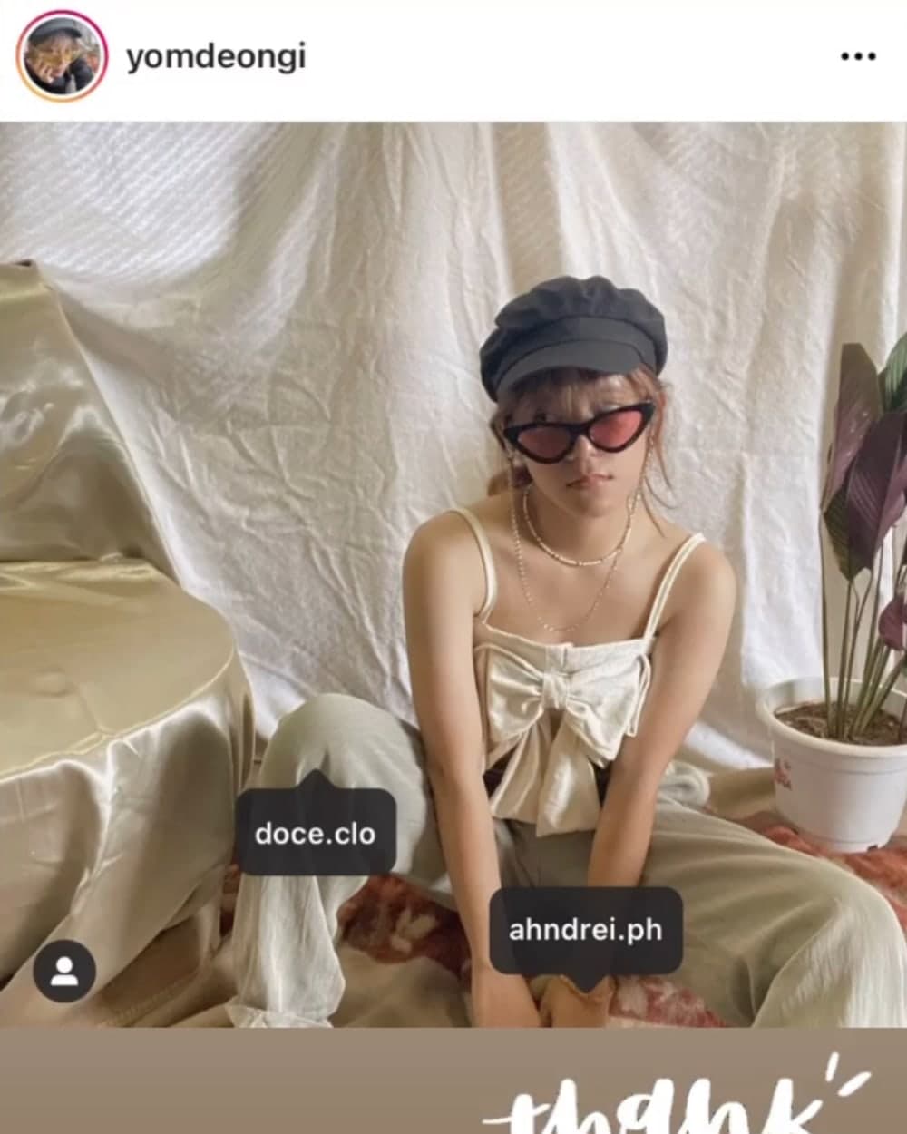 A customer in a cream doce bow-front top with wide trousers